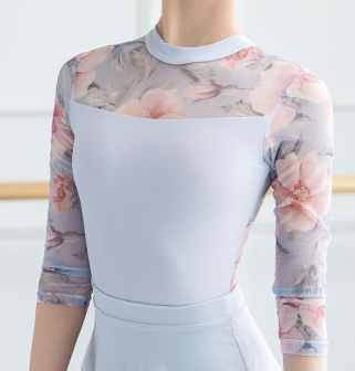 Pale blue leotard with rose printed mesh long sleeves and back. from The Collective Dancewear
