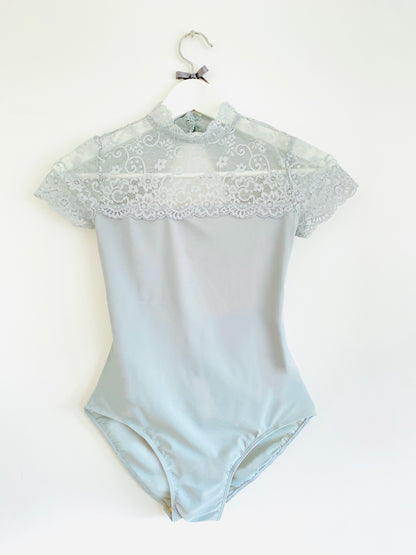 Ballet leotard with lace top and cap sleeves and two buttons in dusky green from The Collective Dancewear 