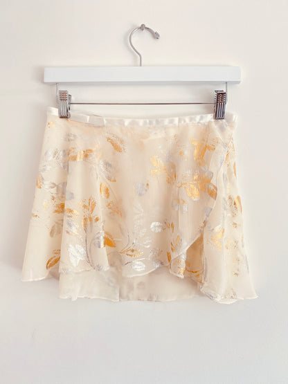 Wrap ballet skirt with gold and silver metal foil leaf print on cream fabric from The Collective Dancewear