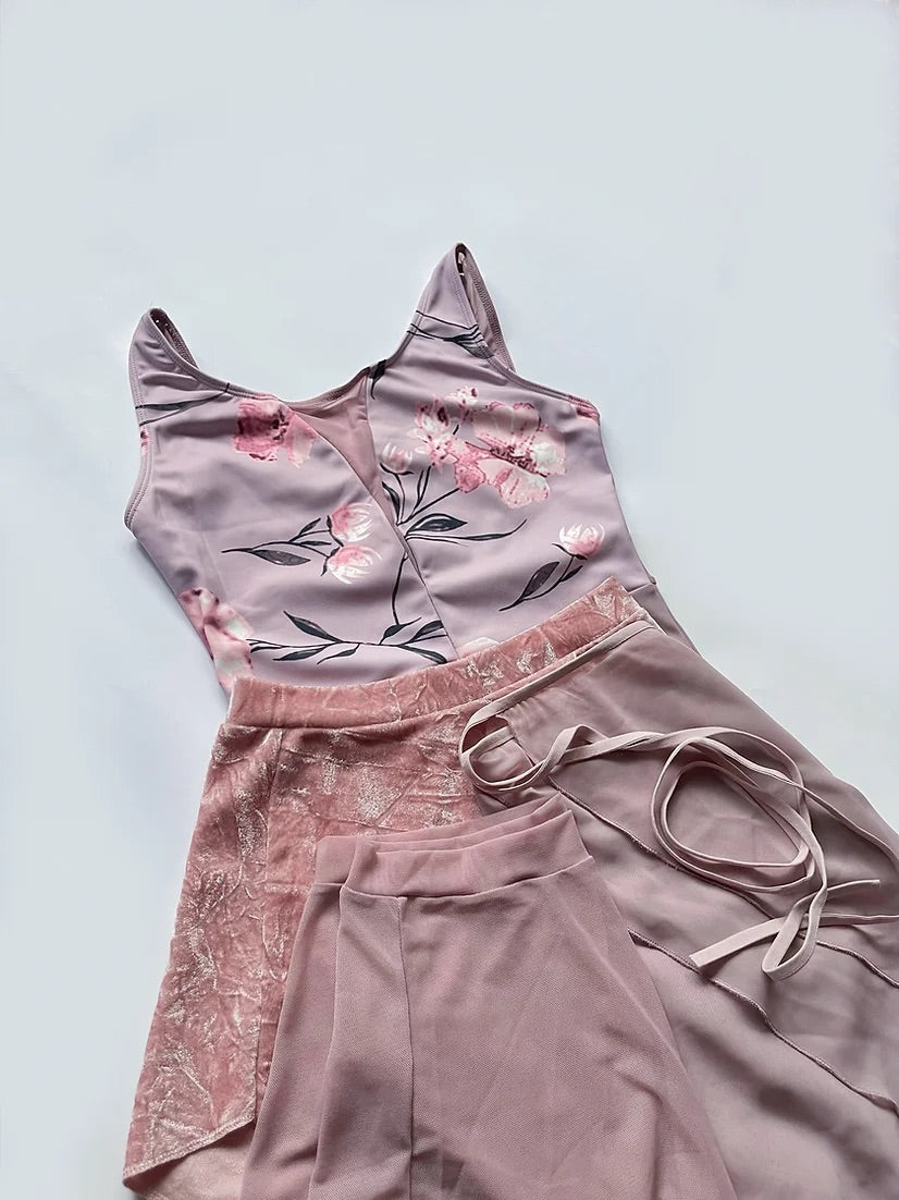 Ballet Leotard in a lilac / dusky pink body with a floral pattern across the bust. Deep mesh back. From The Collective Dancewear collboration with Ballet Skirts By Lucinda. 