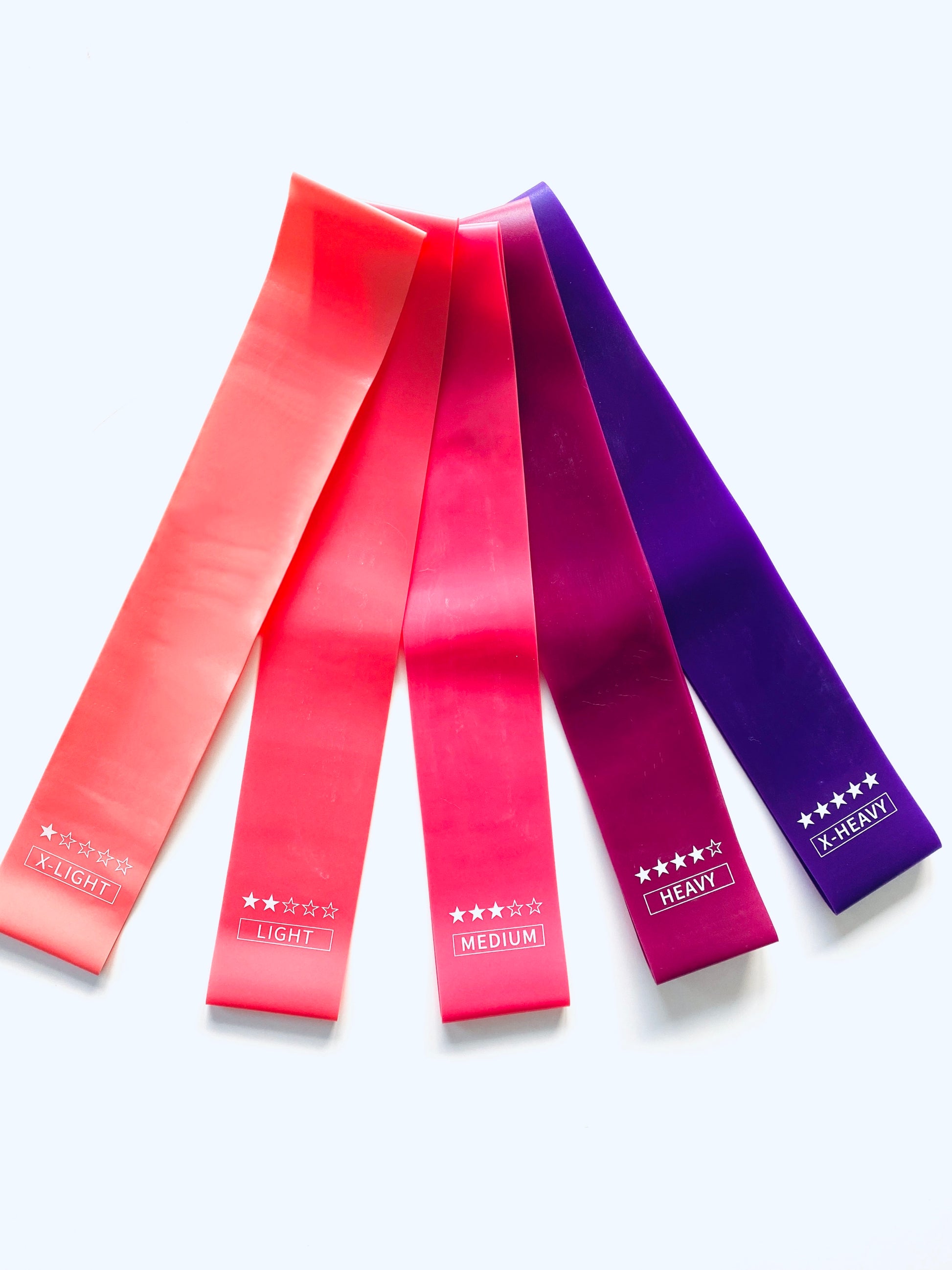 pack of 5 strengthening resistance bands in pinks and purples from The Collective Dancewear