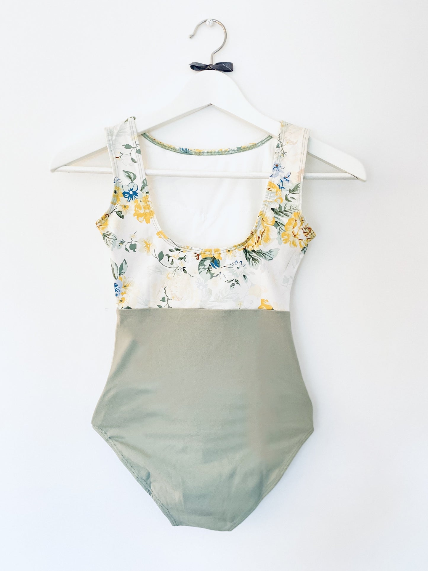 leotard in floral print sage and yellow . Sleeveless tank leotard from The Collective Dancewear Petite