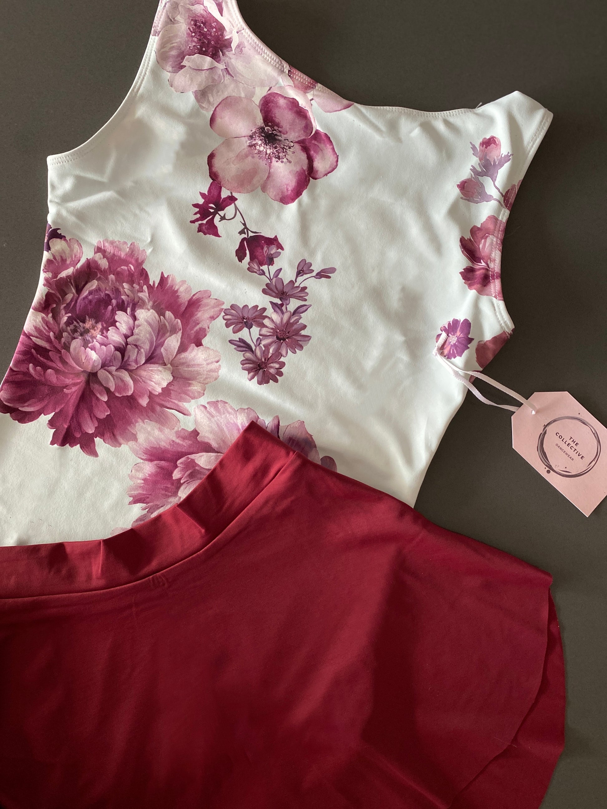 Leotard in pale blue with burgundy flower pattern from The Collective Dancewear with matching ballet skirt in burgundy