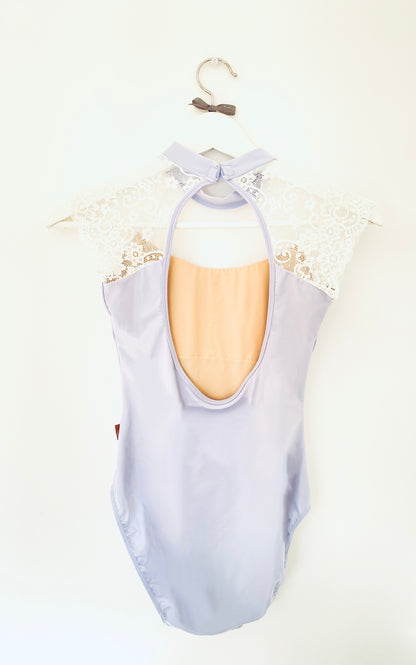 Beautiful leotard in pale blue with laced cap sleeves in white and a high neck from The Collective Dancewear