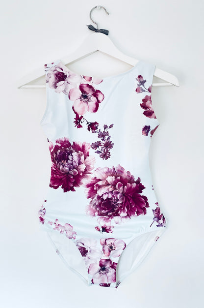 Leotard in pale blue with burgundy flower pattern from The Collective Dancewear