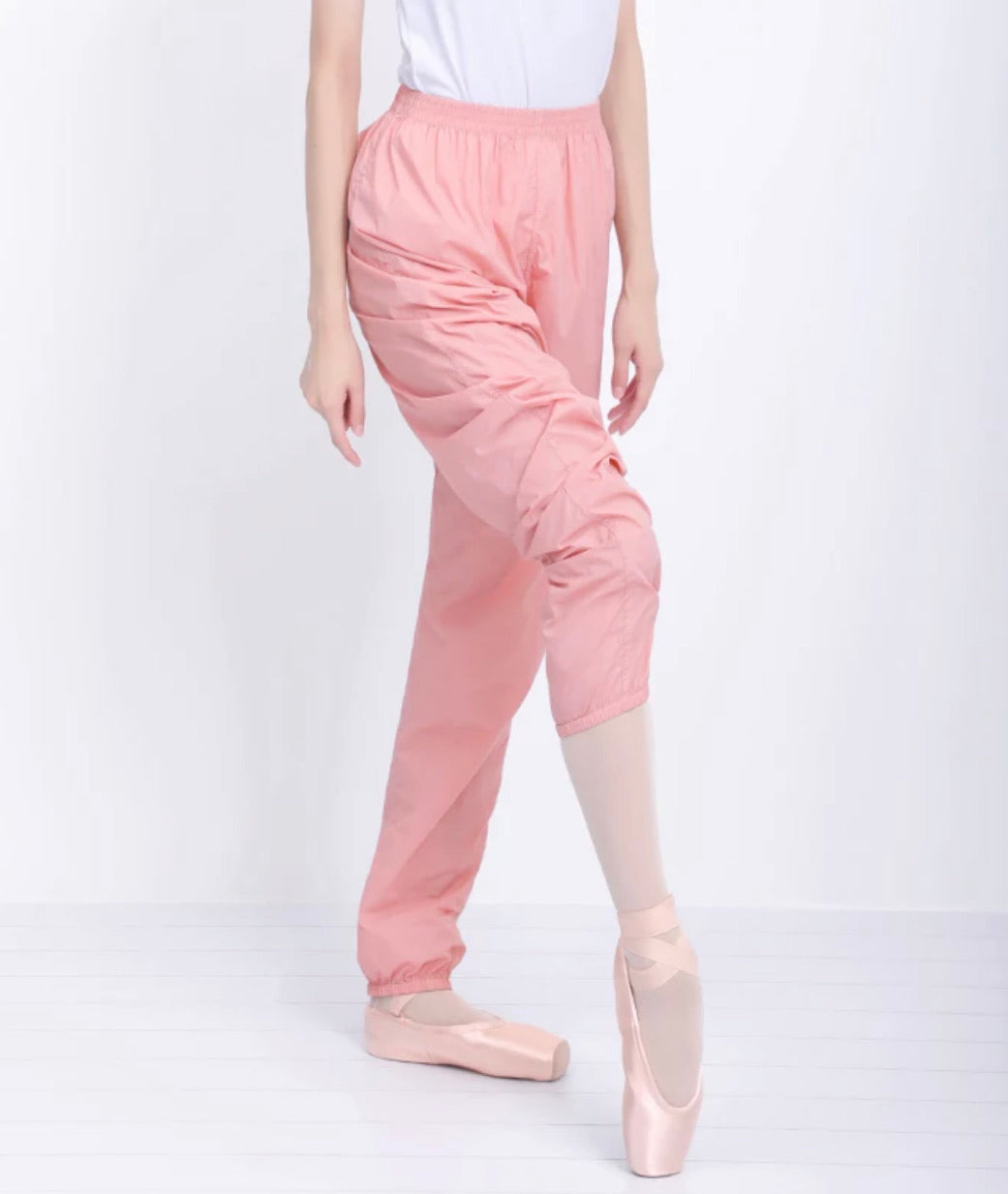 Pink trash pants / sauna pants / warmup pants for dancers from The Collective Dancewear