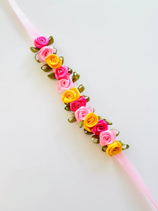 Bunwrap / hair accessory for ballet bun in bright coloured small roses. from the collective dancewear