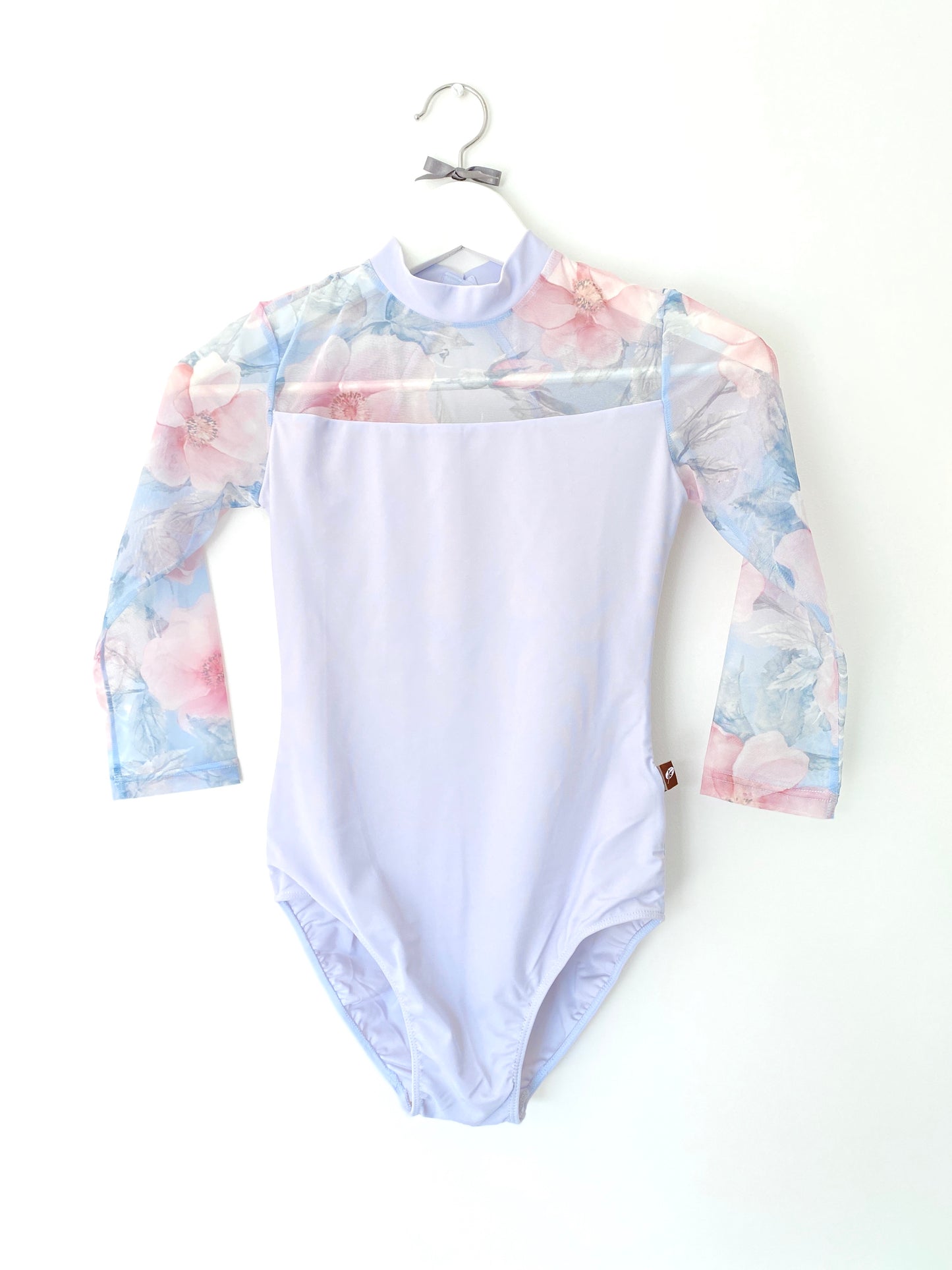 Pale blue leotard with rose printed mesh  long sleeves and back. from The Collective Dancewear