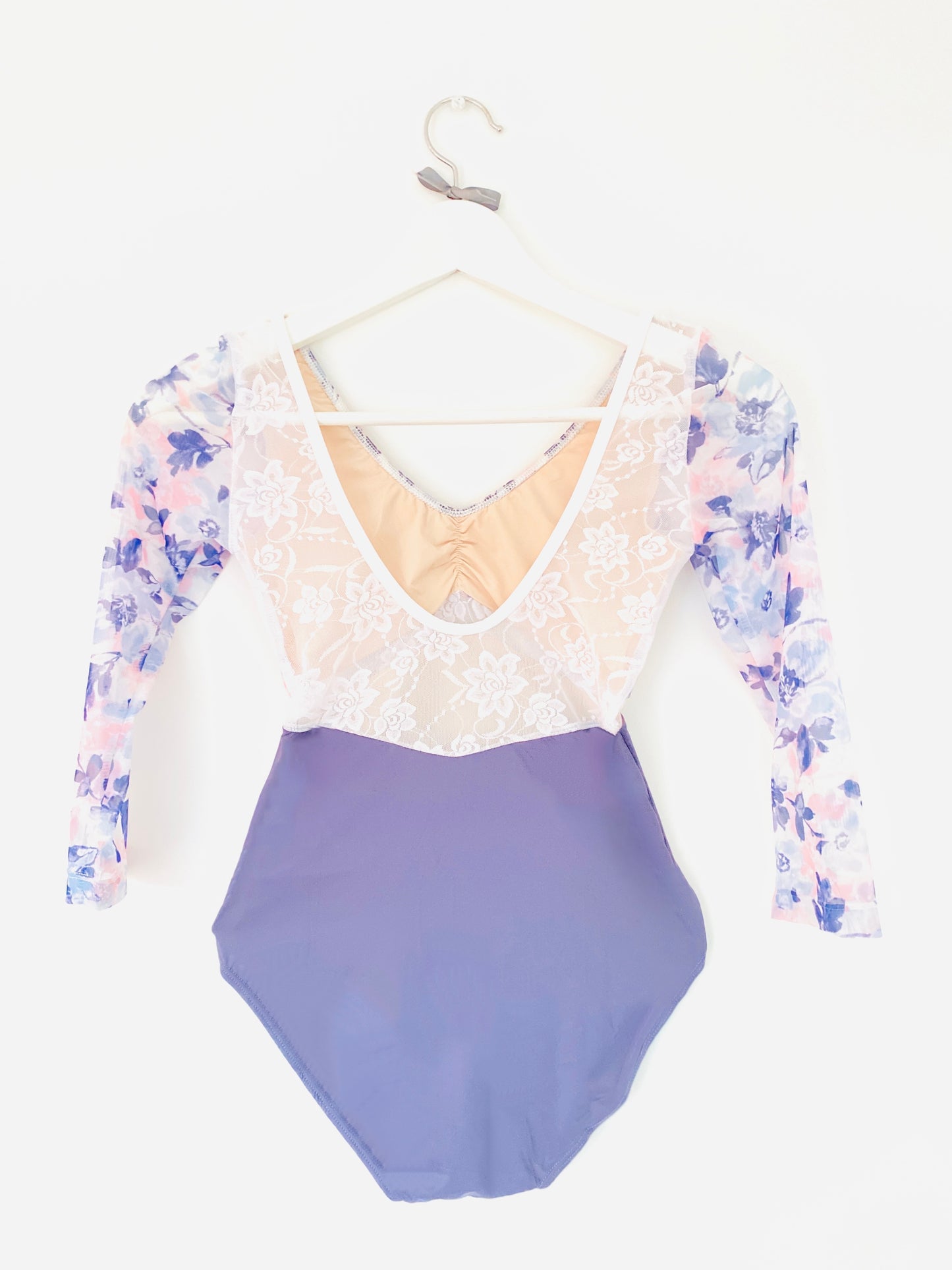 Floral plum leotard with a deep lace back and long sleeves from the Collective Dancewear